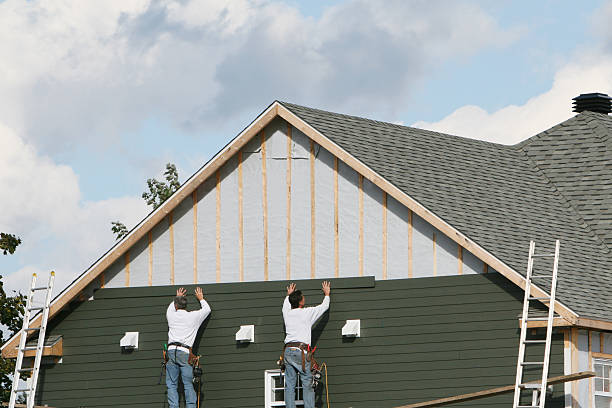 Professional Siding technician working in Coram, NY